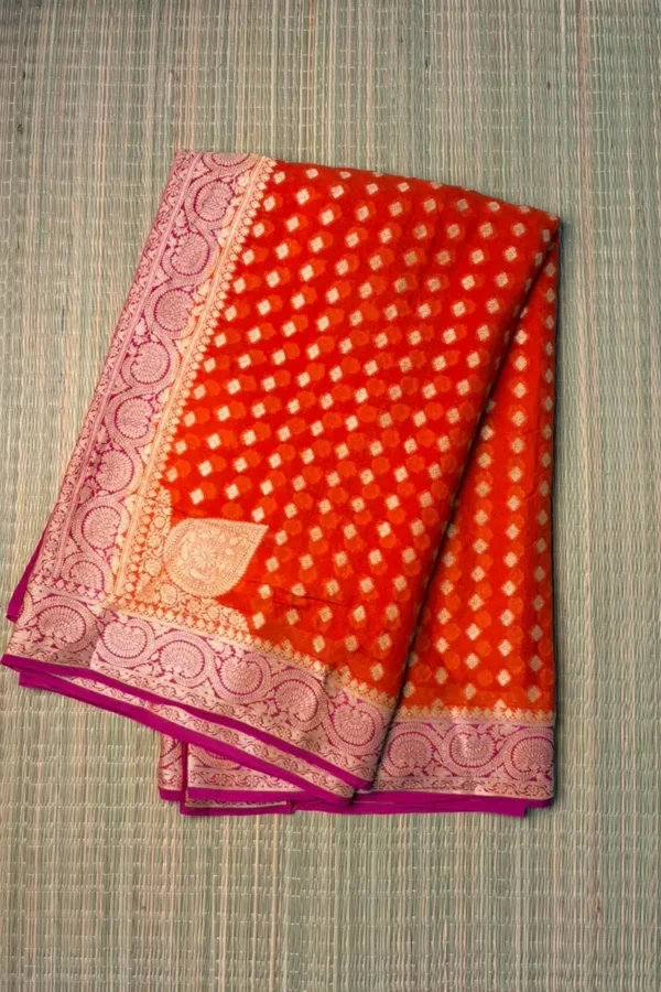 Bright Orange Pure Georgette Saree with Magenta Piping Border