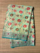 Turquoise Blue Floral Pure Georgette Saree with Blue Border
