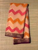 Tricolour (orange, peach and pink) zigzag saree with brown border